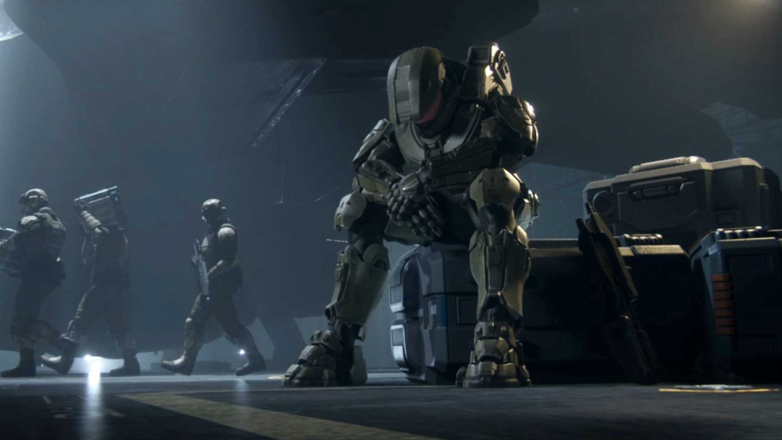 Master Chief sitting alone, hanging his head.
