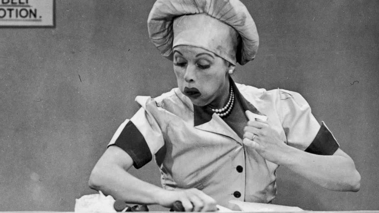 Lucy Ricardo stuffs chocolates from the assembly line into her mouth and down her top.