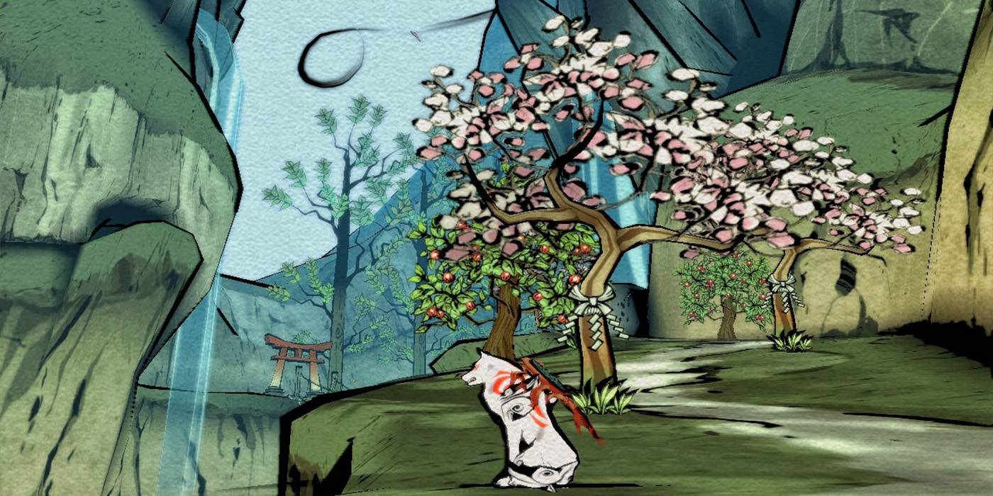 The wolf Amaterasu sits next to a blooming tree in Okami.