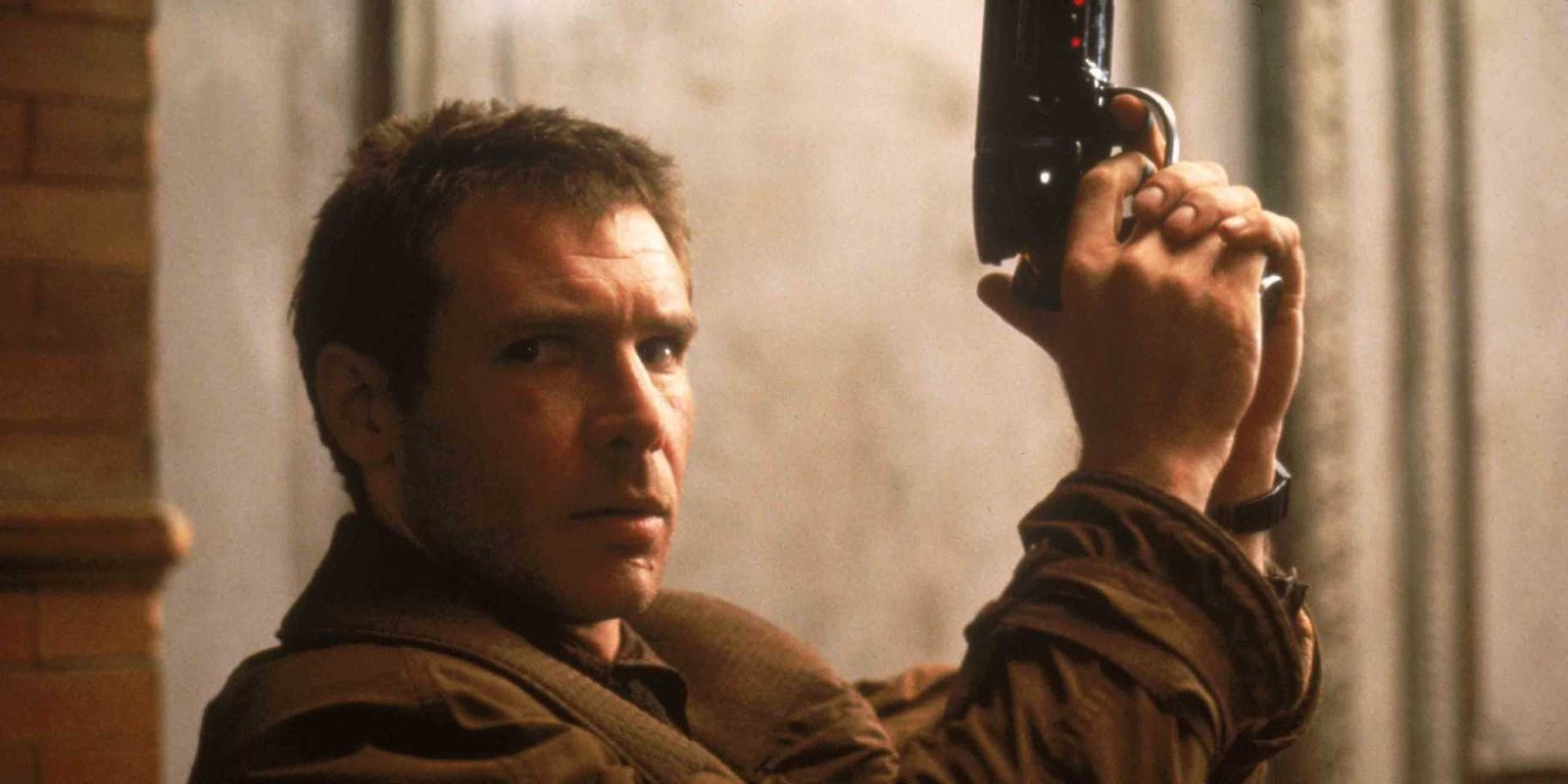 Harrison Ford as Deckard holding his gun in Blade Runner