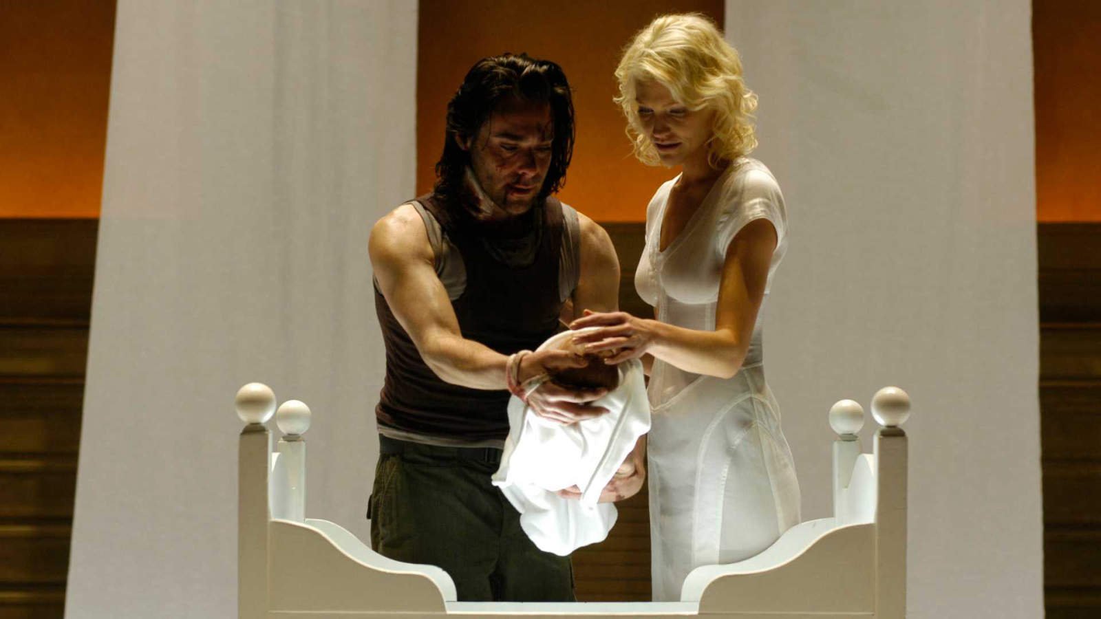 How Battlestar Galactica Spent 14 Years Waiting To Beat Star Trek At Its Own Game 29 Gaius and Six holding a baby in Battlestar Galactica.