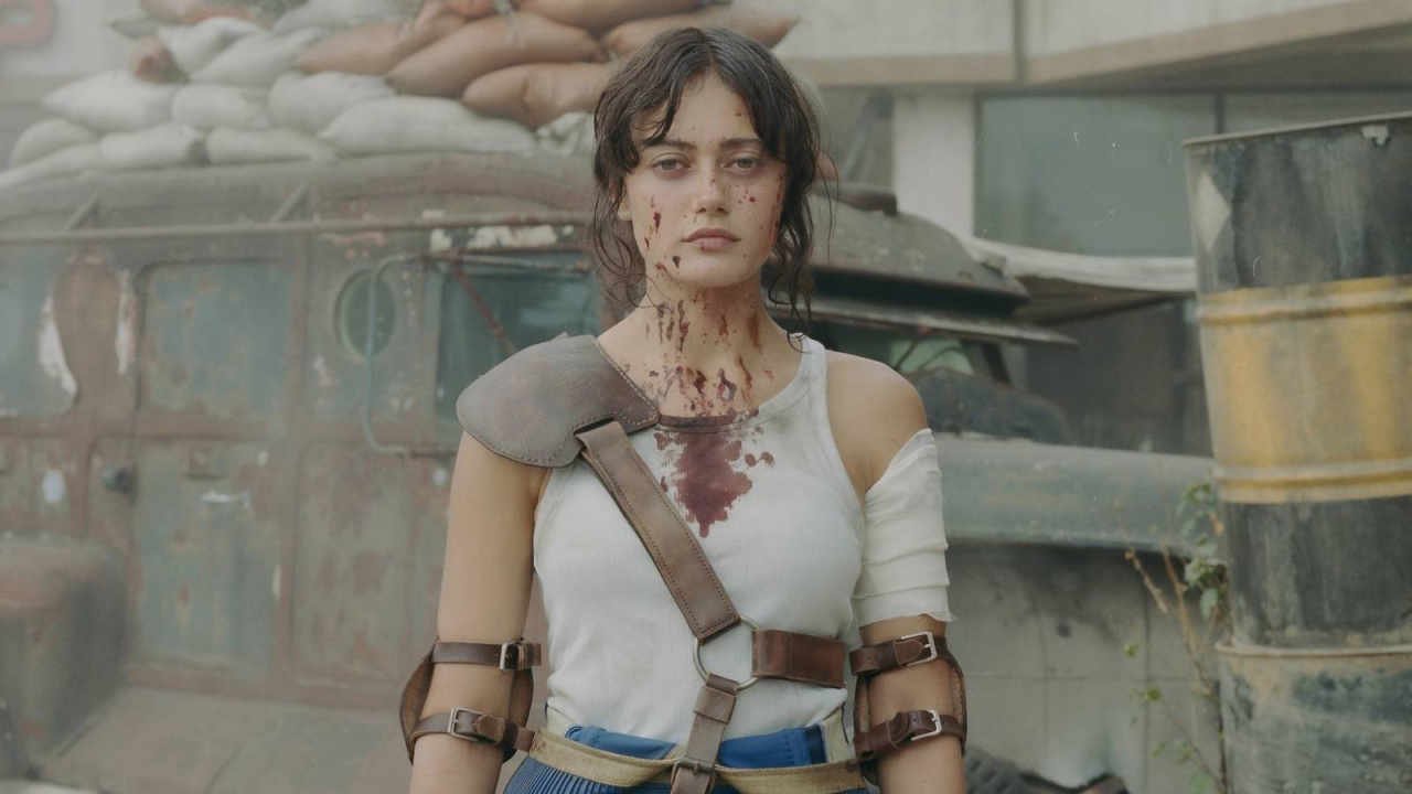 fallout on prime video borrows from arcane and the last of us then outruns both A woman in a blue jumpsuit hauls herself out of a hole in the ground nine years after the events of Fallout 4, only to find that everyone up on the surface is worse than the stories ever suggested.