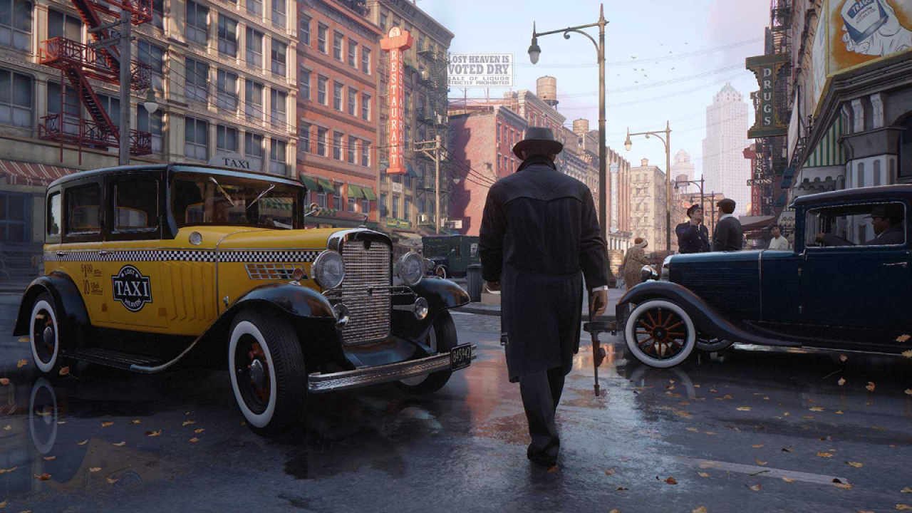 Free on PS5 and Xbox Now: The Remake of That 2004 PlayStation 2 Classic 28 Tommy walking through the streets near a taxi while holding a tommy gun in Mafia Definitive Edition.