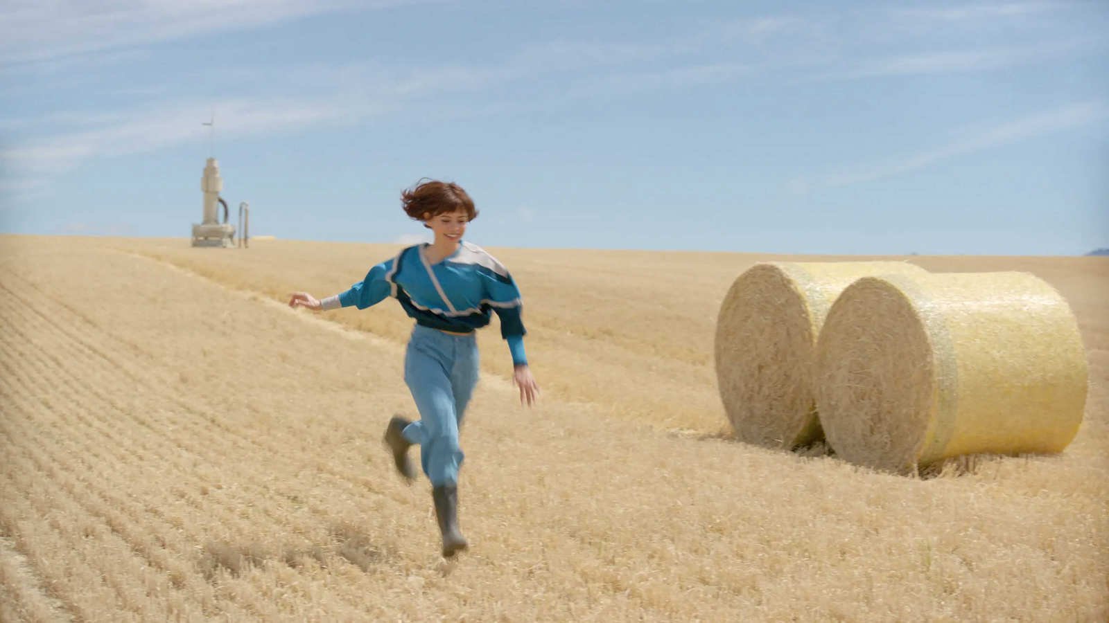 Jenna Ortega's Klara running through a field in Klara and the Sun