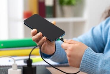 using your phone while its plugged in wont destroy the battery heres why Try this: game on your phone while it's charging, pull the cable after an hour, and look at the percentage. Odds are it hasn't climbed much. Nothing is wrong with your cable, and your battery isn't dying. That's bypass charging doing precisely the job it was designed for.
