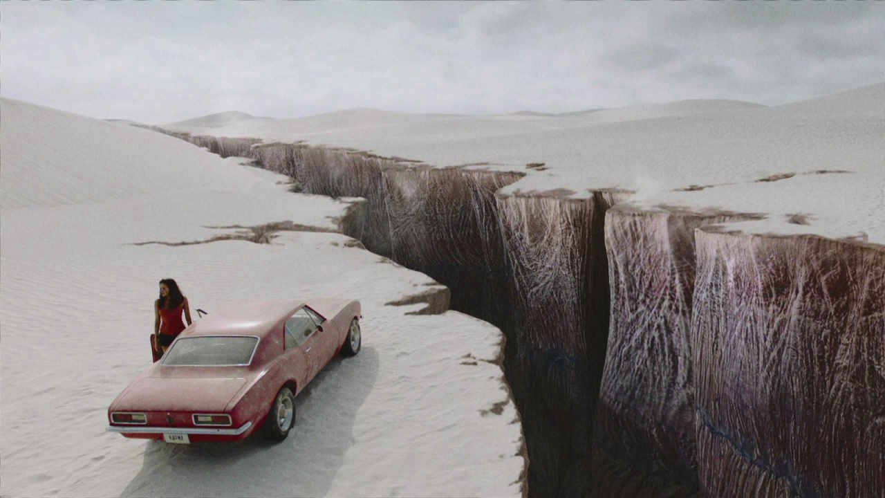 Blood Drive: Alan Ritchson's Forgotten 13-Episode Sci-Fi Racer Is Fallout by Way of Mad Max 29 Grace (Christina Ochoa) standing by her car and the ravine in Blood Drive.