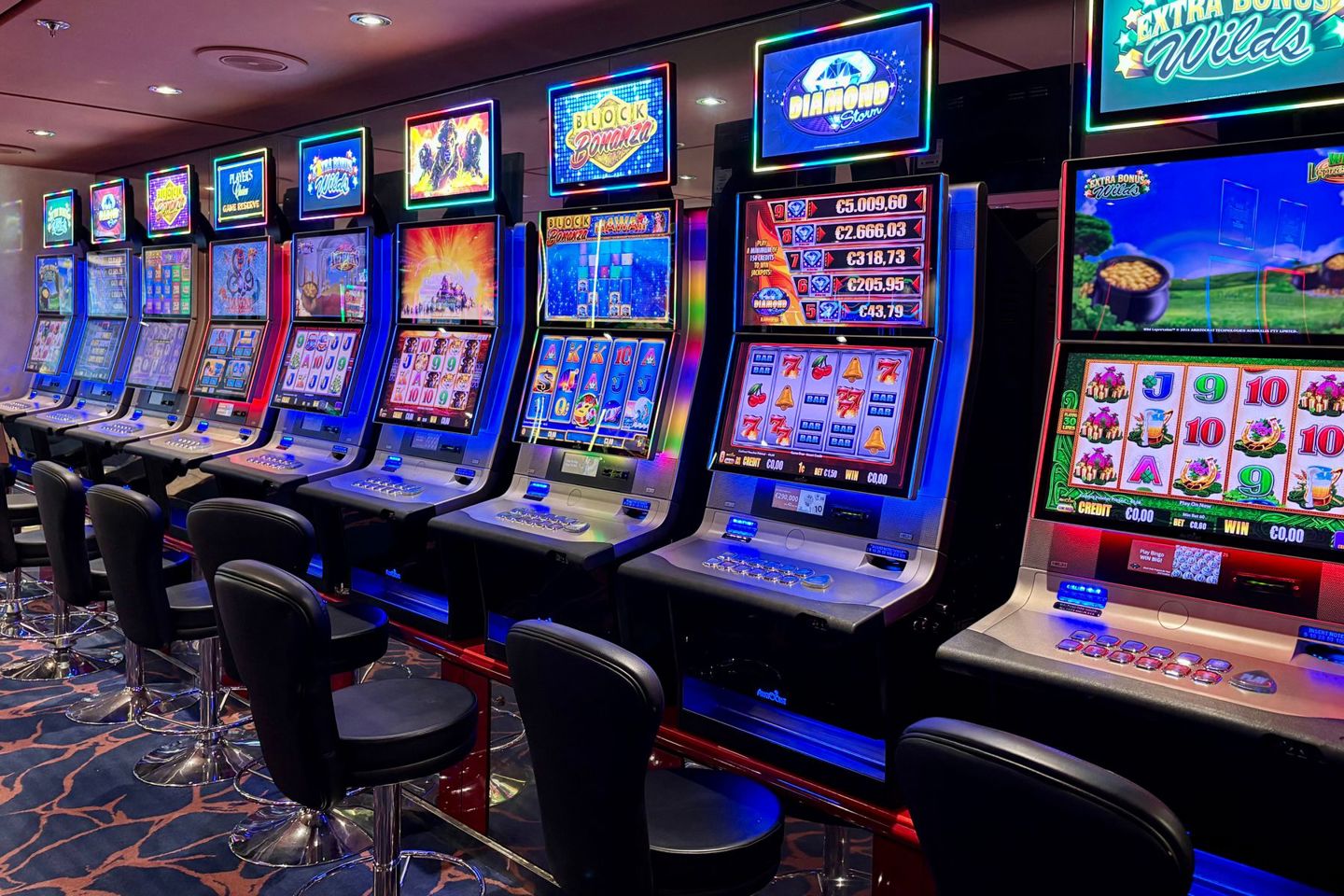 Bright casino slot machines with colorful displays